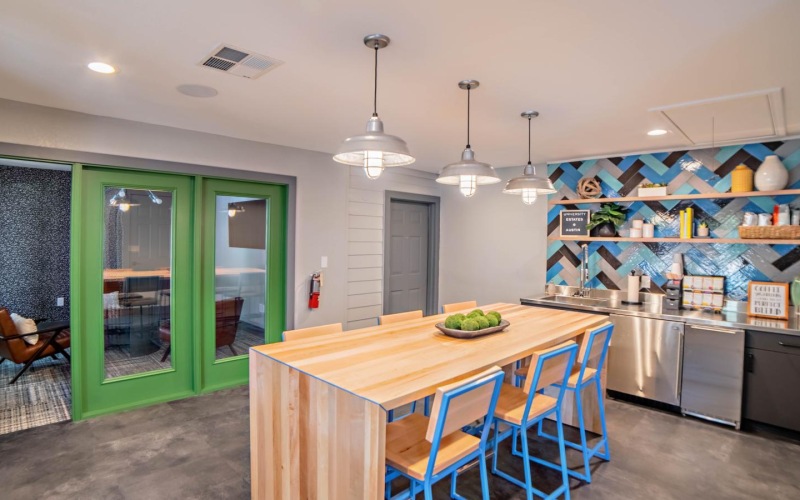 a kitchen with a table and chairs