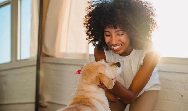 We're a pet-friendly community a person petting a dog