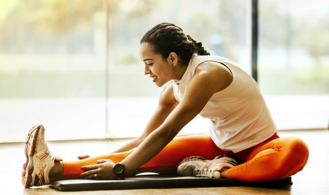 Get your workout on a person stretching their legs