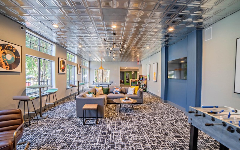 a lounge with a couch and chairs